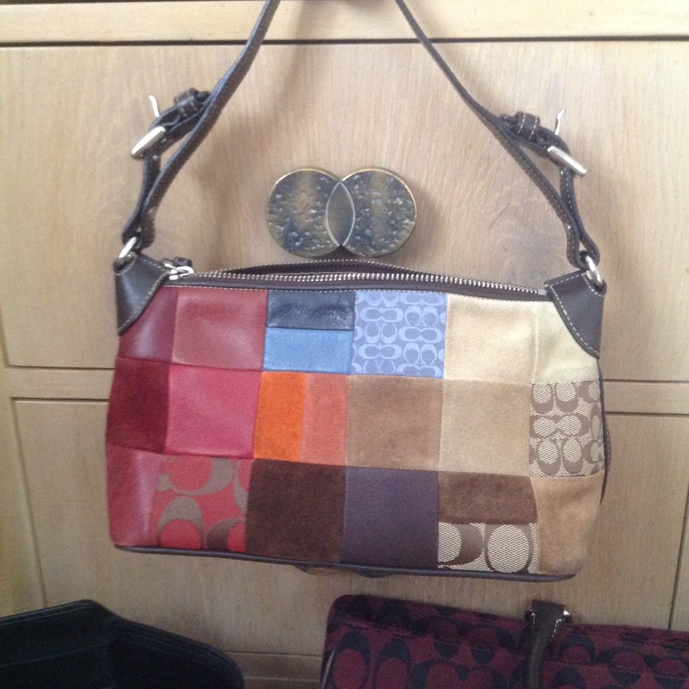 Multi color leather shoulder bag by Coach.